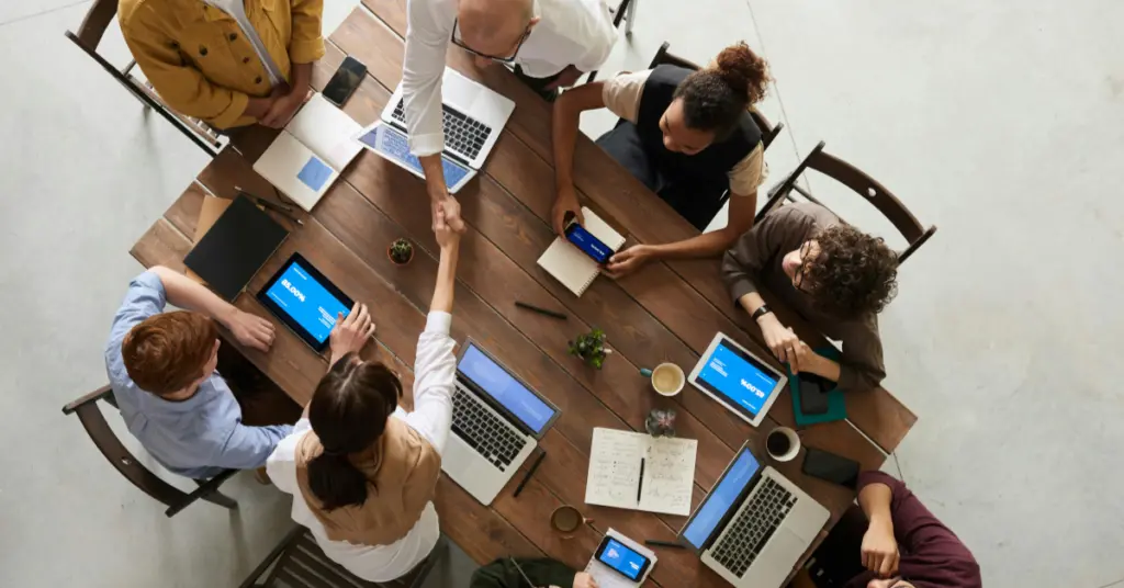 A group of people having ameeting in a table