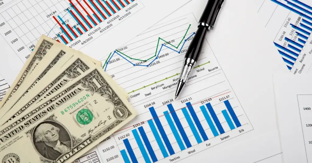 A paper with graphics, money and a pen