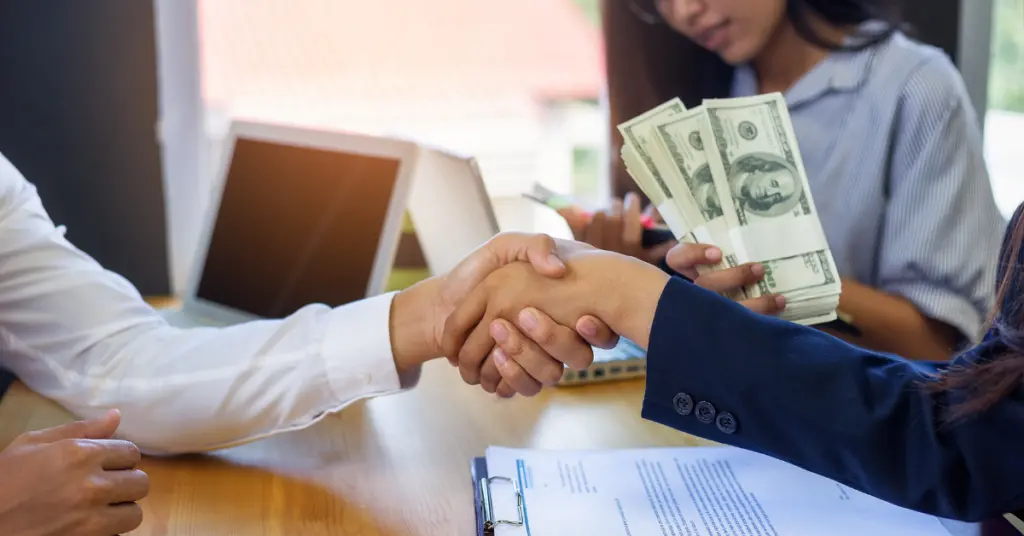 two people shaking hands