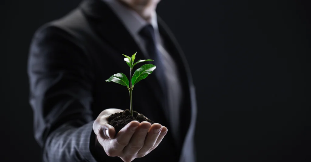 A man holding a plant