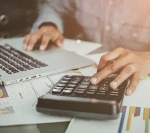 a persona using a calculator